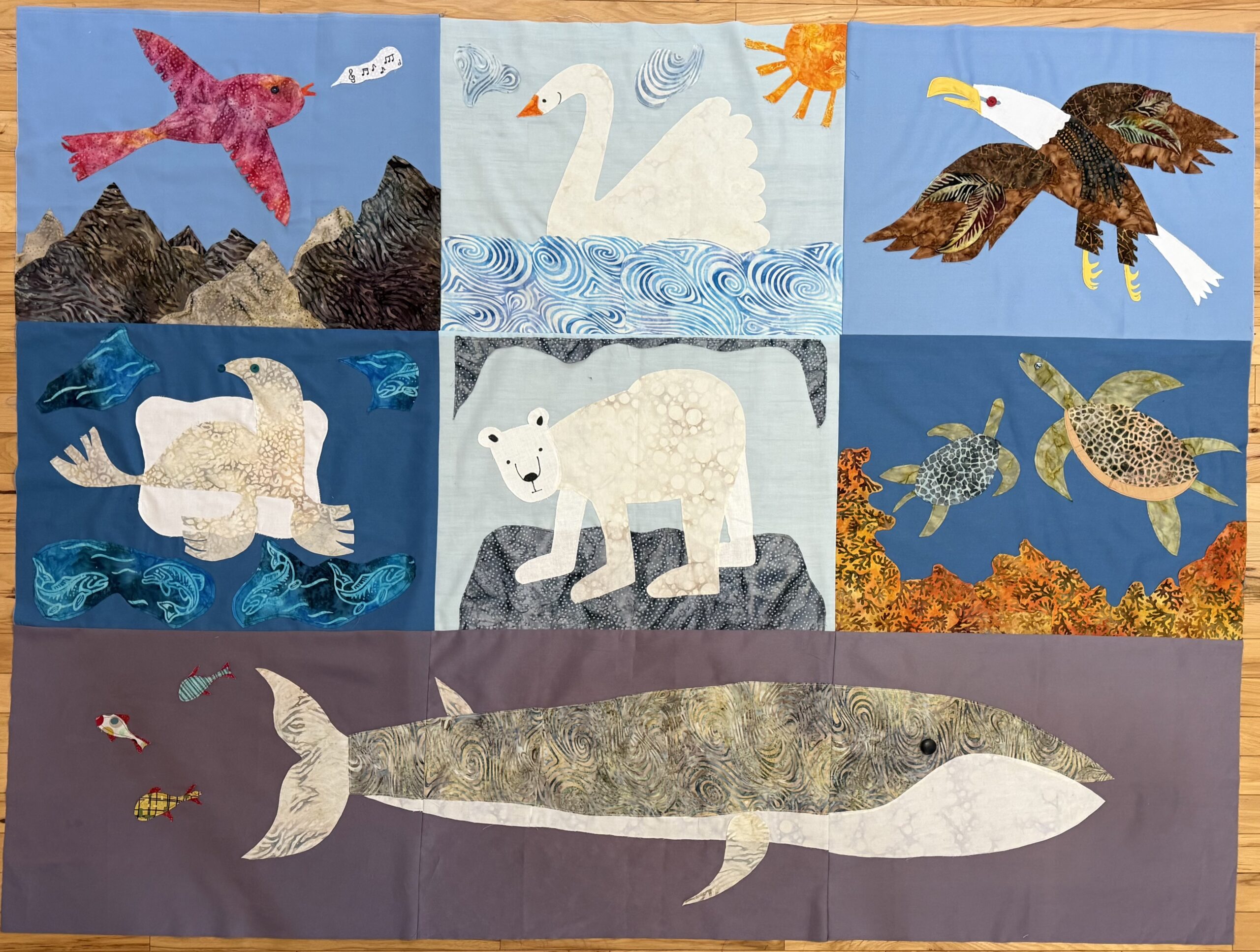 Quilt depicting arctic animals impacted by climate change