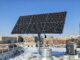 Solar array on UK rooftop with UK dorms in the background